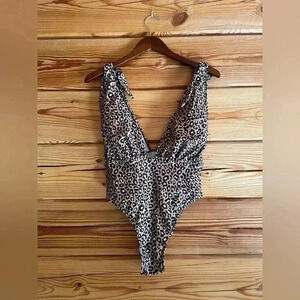 NWOT cheetah one piece​​​​